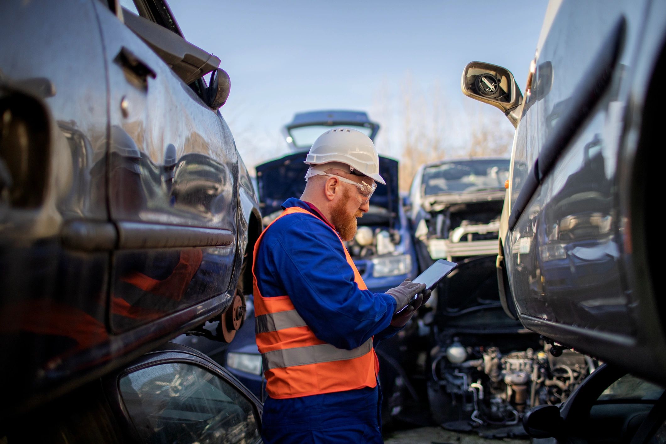 scrap car removal team at work outdoors