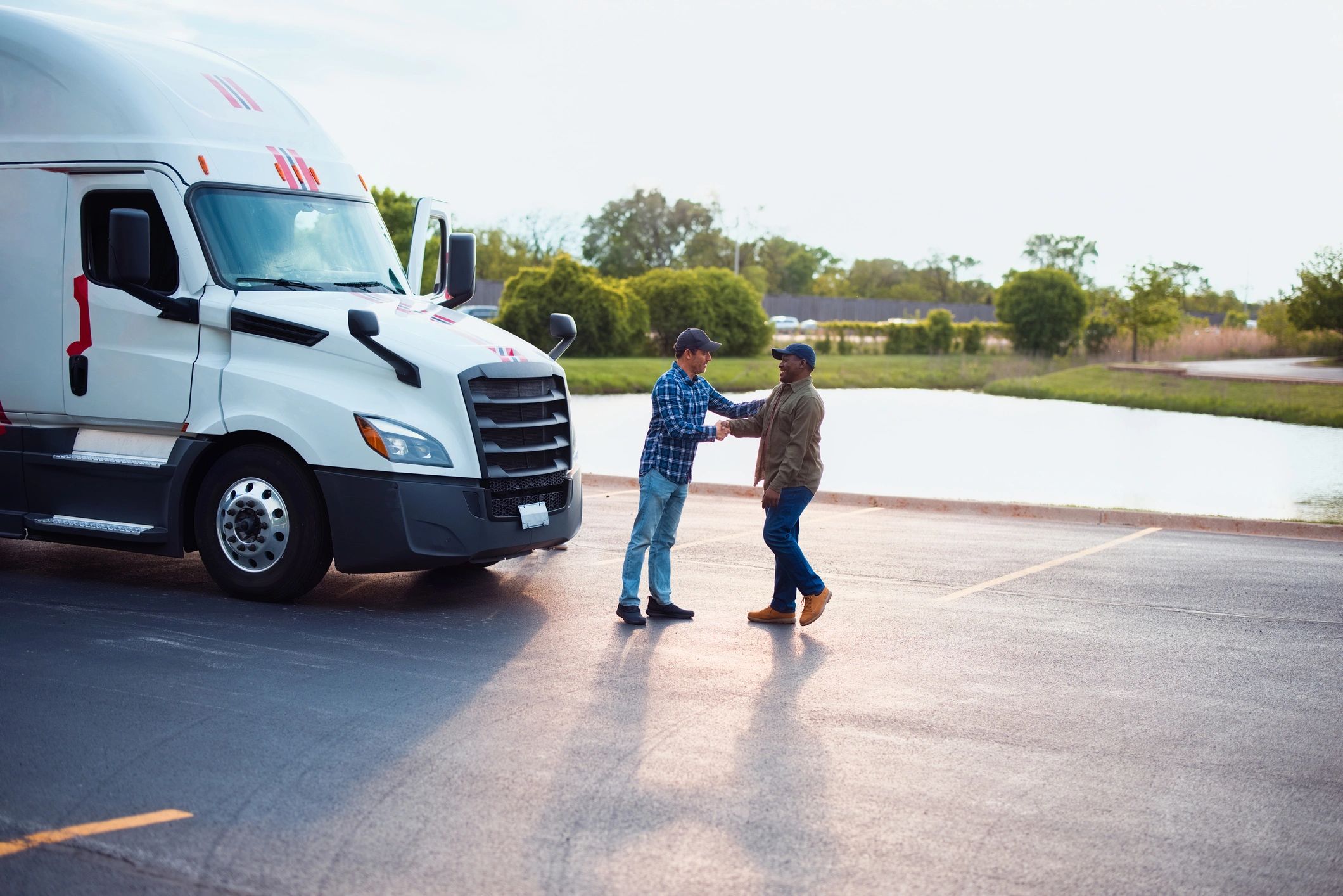 happy customer with tow truck driver