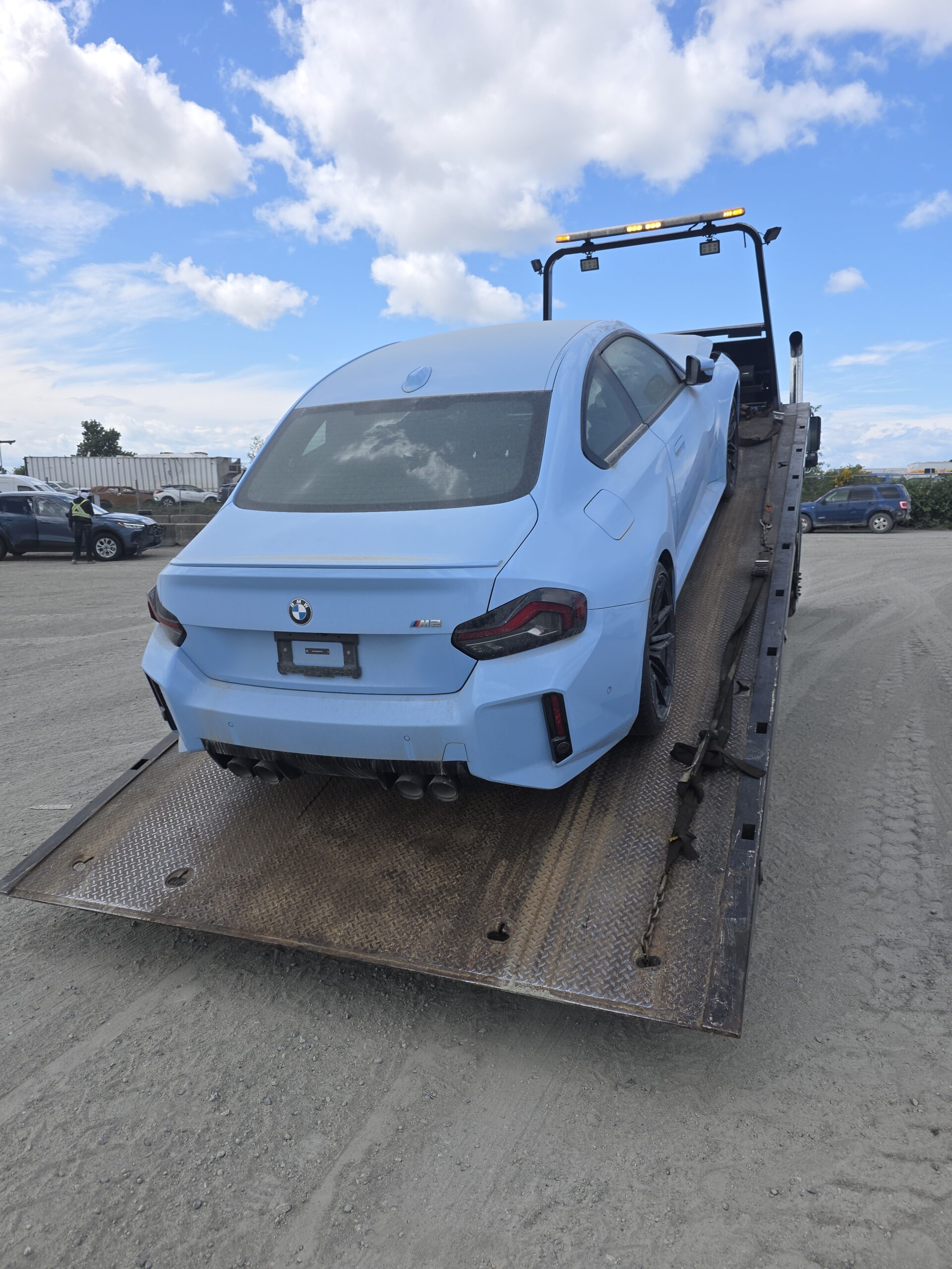 BMW M2 secured on the flatbed during same day cash purchase pickup in Coquitlam